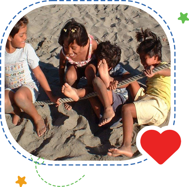 A group of children sitting on the beach