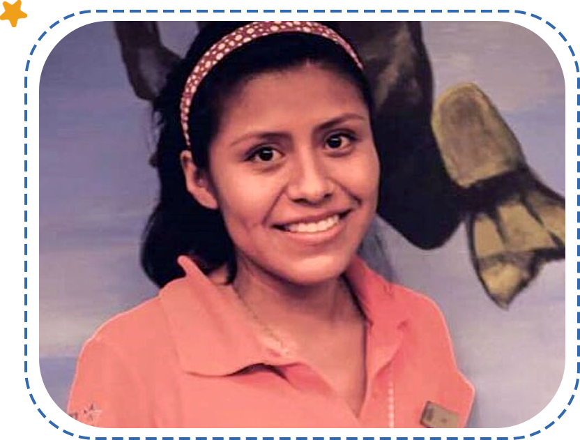 A young woman wearing an orange shirt and headband.