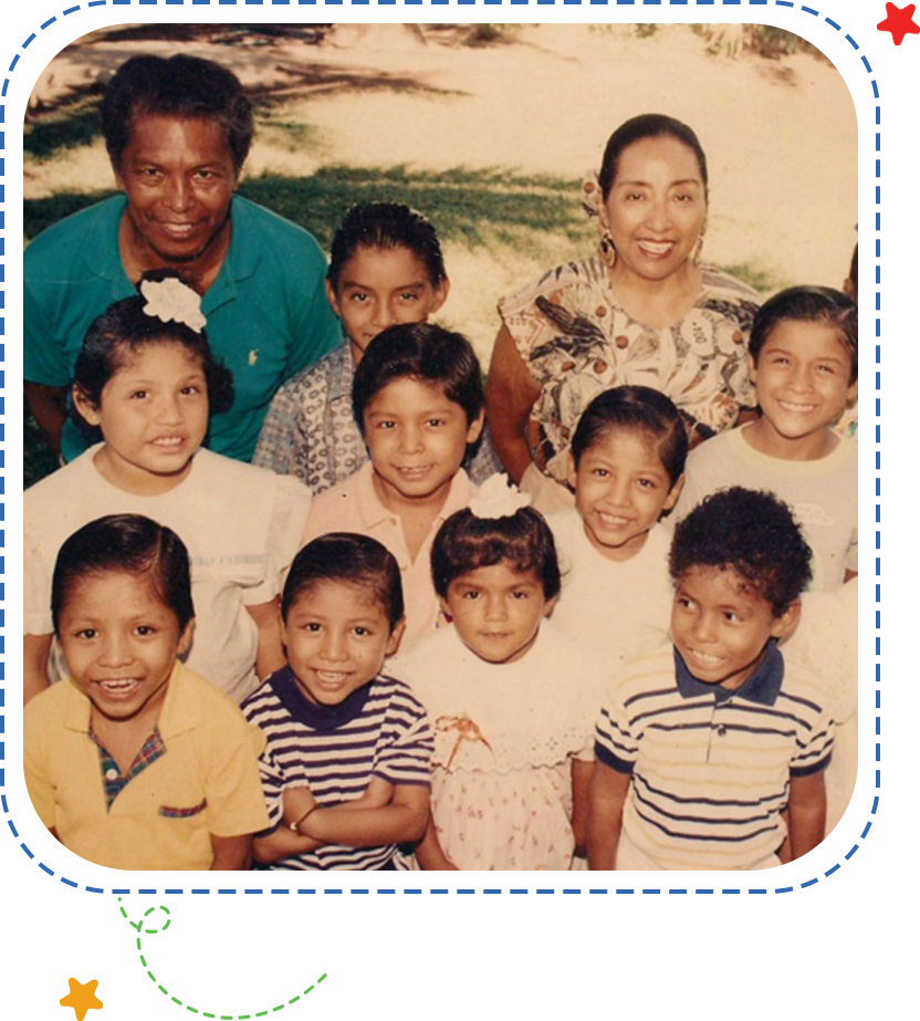 A group of children and adults posing for the camera.