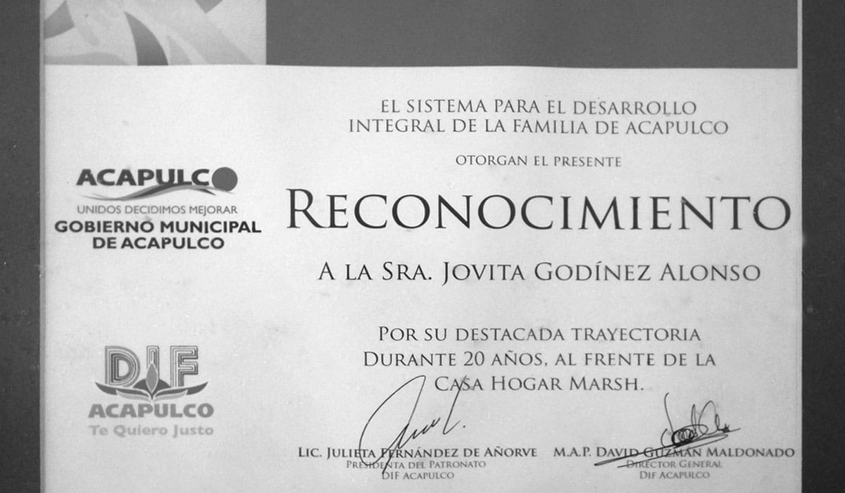 A certificate of recognition for the restoration of a house.